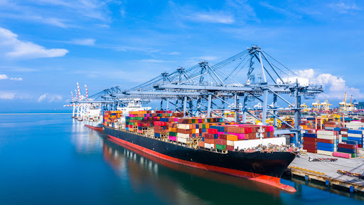 A cargo ship with many shipping containers onboard.